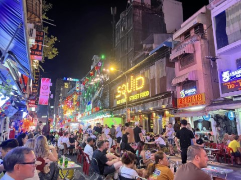 Bui Vien Walking Street in Ho Chi Minh City, a lively nightlife area filled with bars, street food, and international travelers.